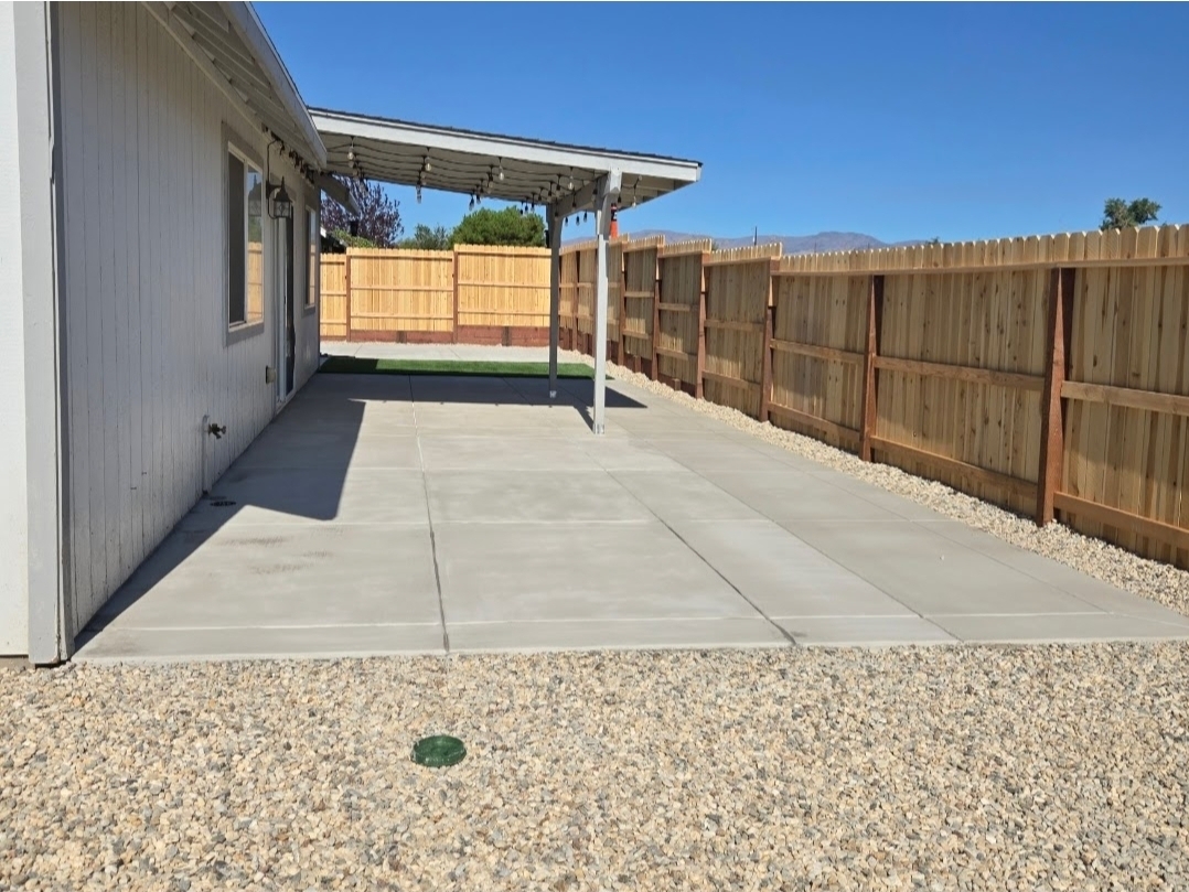 Concrete patio under pergola
