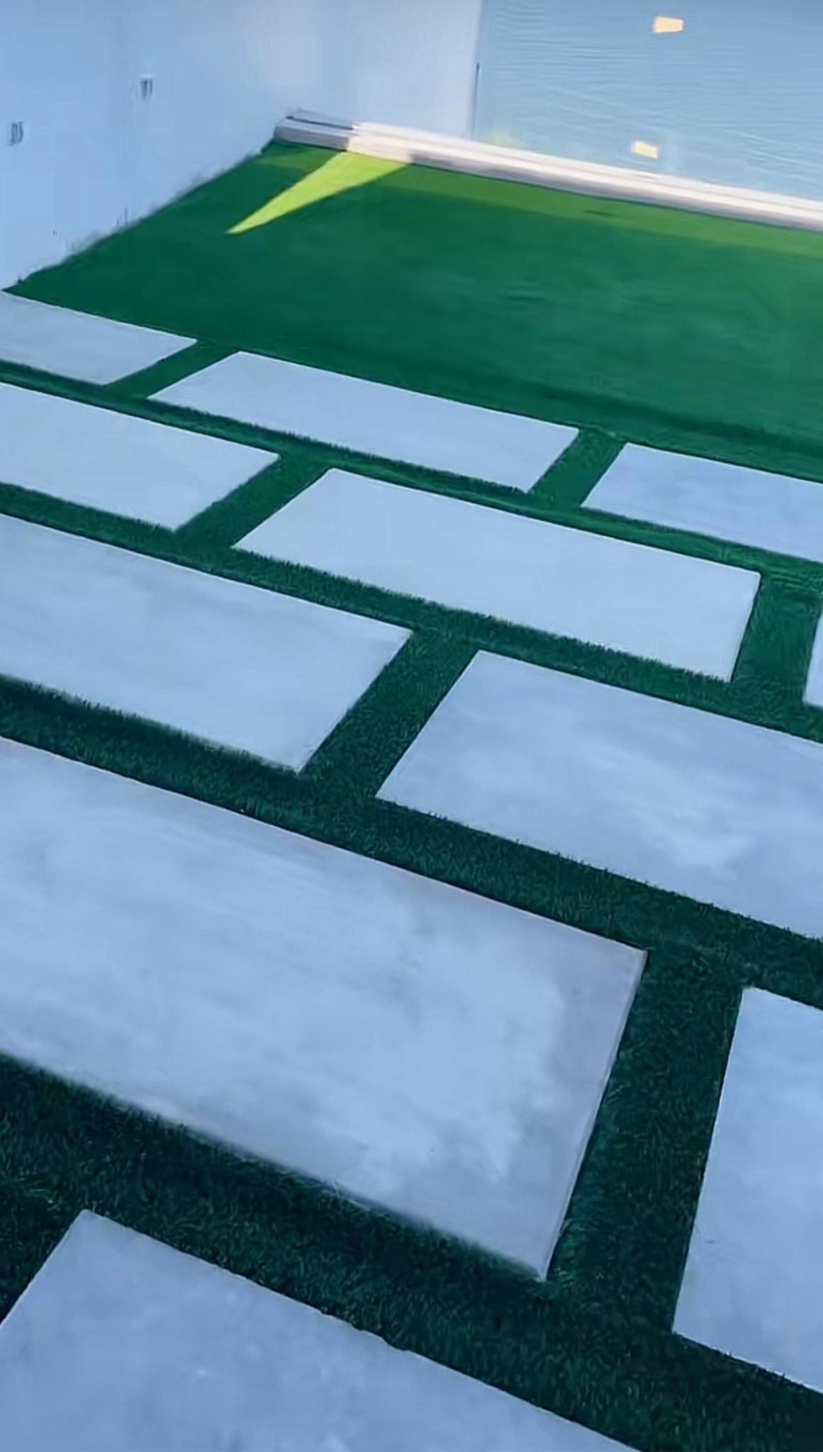 Concrete stepping stones artificial turf