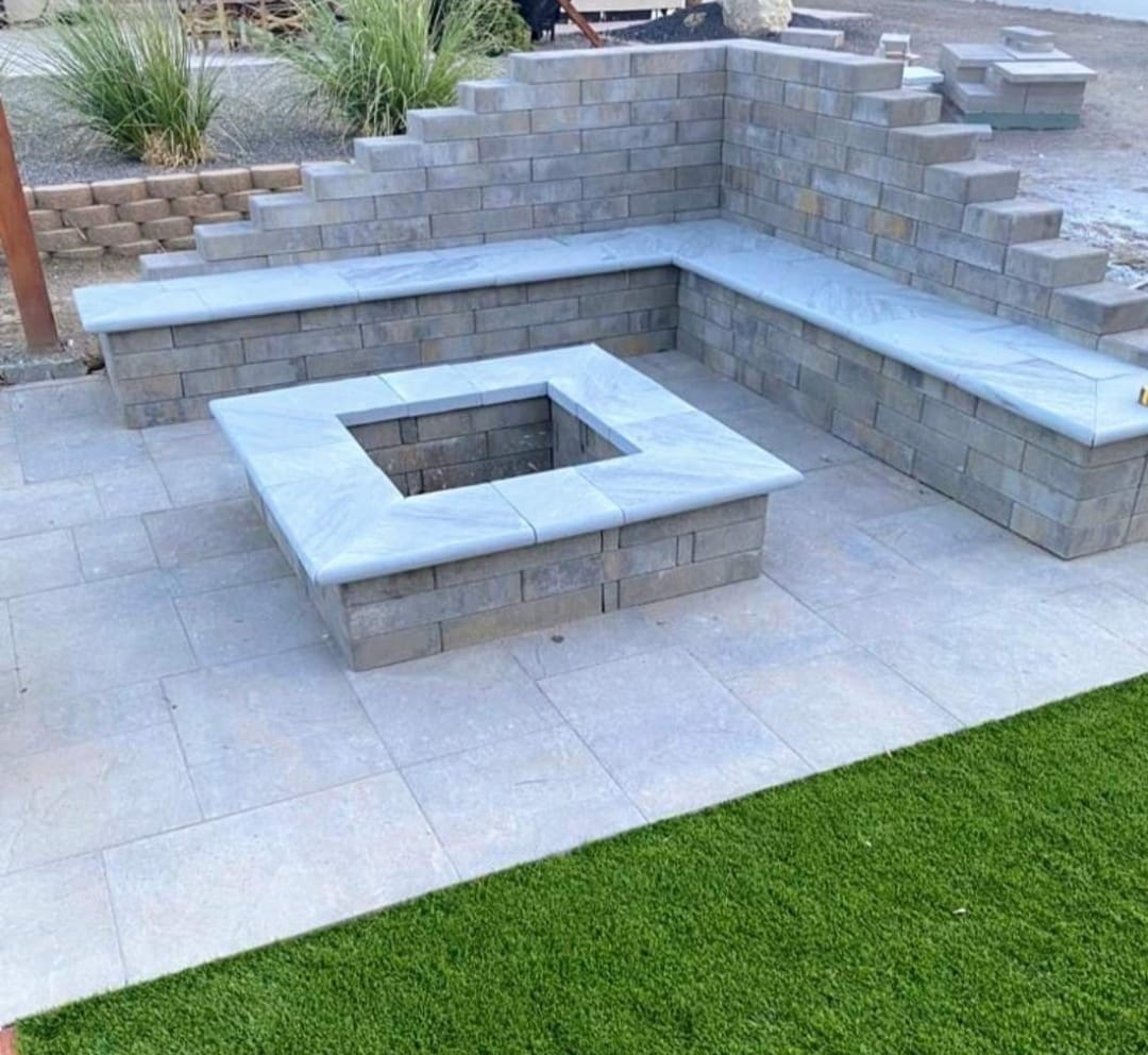 Custom square fire pit with travertine patio