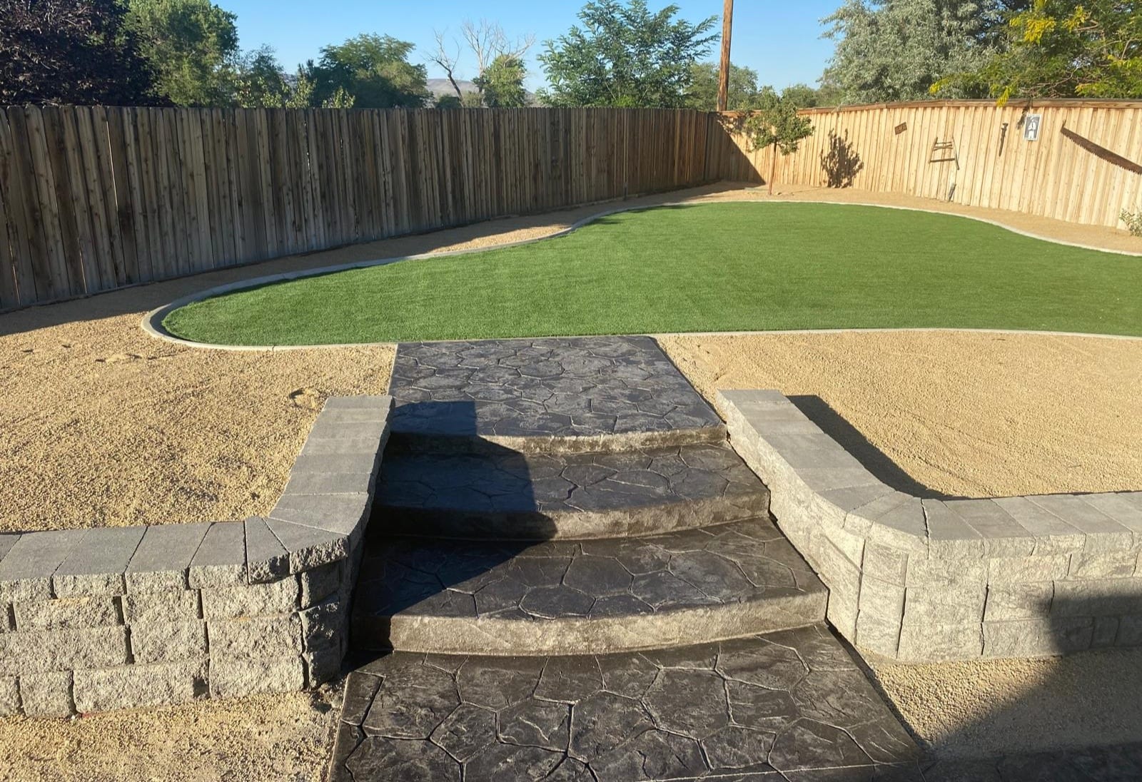 Retaining wall stamped concrete backyard