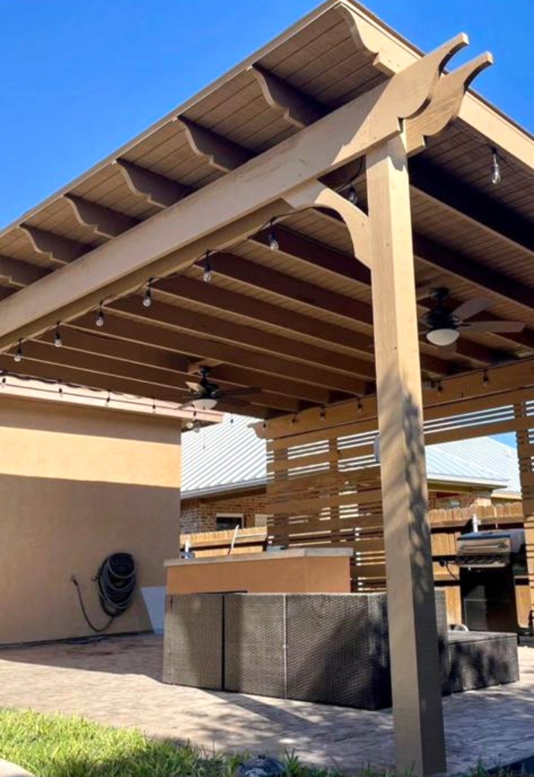 Wood pergola with outdoor kitchen